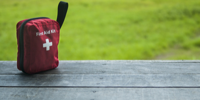 First aid kit on table outdoors