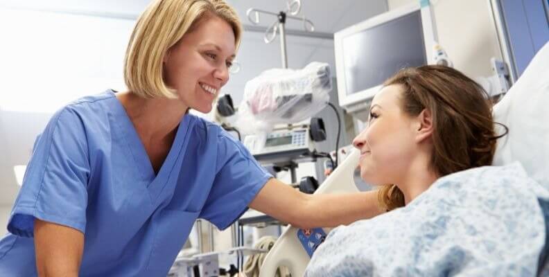 Nurse Reassuring Patient Going to Surgery