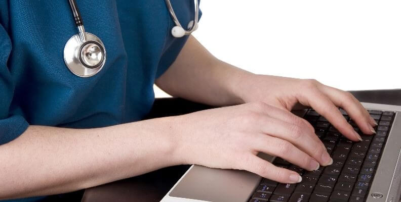 Nurse Documenting on Computer