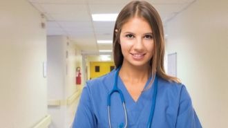 Nurse-in_scrubs_in_hospital_hallway