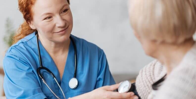 Nurse Taking Patient's Blood Pressure