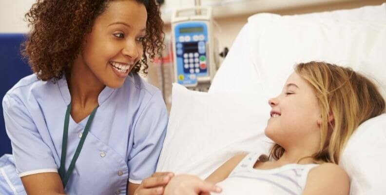 Pediatric Nurse With Patient