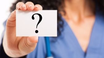 nurse_holding_question_mark_card
