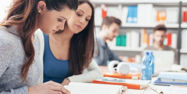 Nursing Students Studying Together in Classroom
